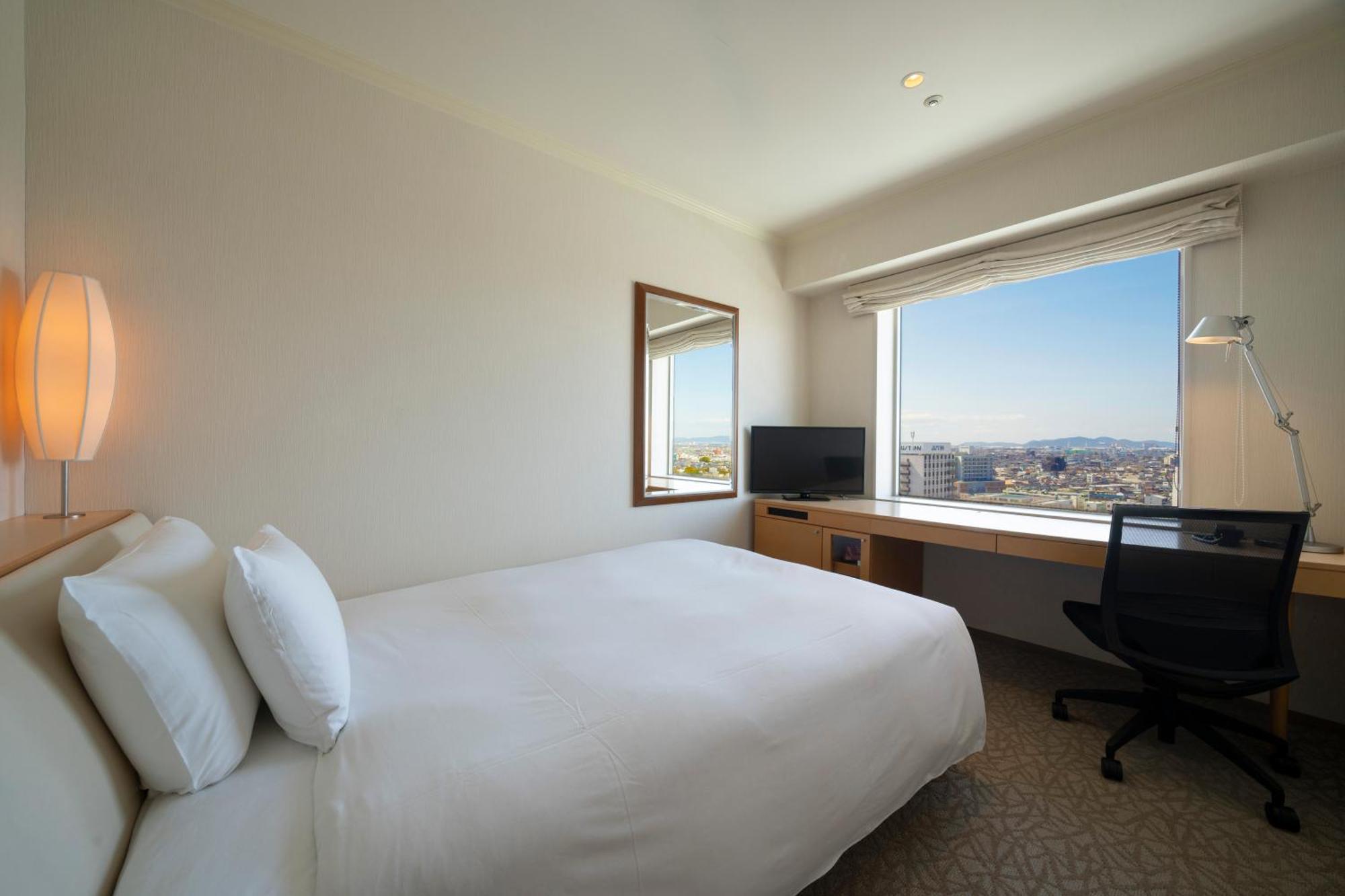 Hotel Associa Toyohashi Exterior foto A room at the hotel